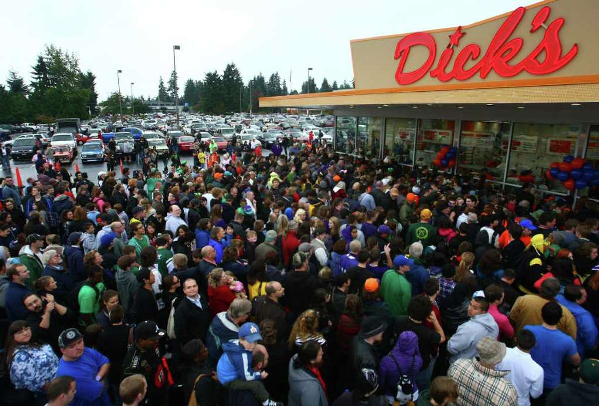 Hundreds of hungry fans wait in line during the grand opening of the Edmonds Dick's Drive-in on Thursday, October 20, 2011. This was the first of new Dick's restaurant in 37 years. The popular hamburger joints are Seattle-area icons.