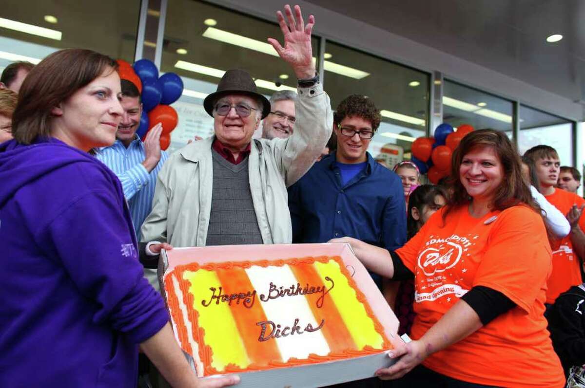Dick Spady waves to fans as they serenade him days after he turned 88 years-old during the grand opening of the Edmonds Dick's Drive-in. This was the first of new Dick's restaurant in 37 years. The popular hamburger joints are Seattle-area icons.