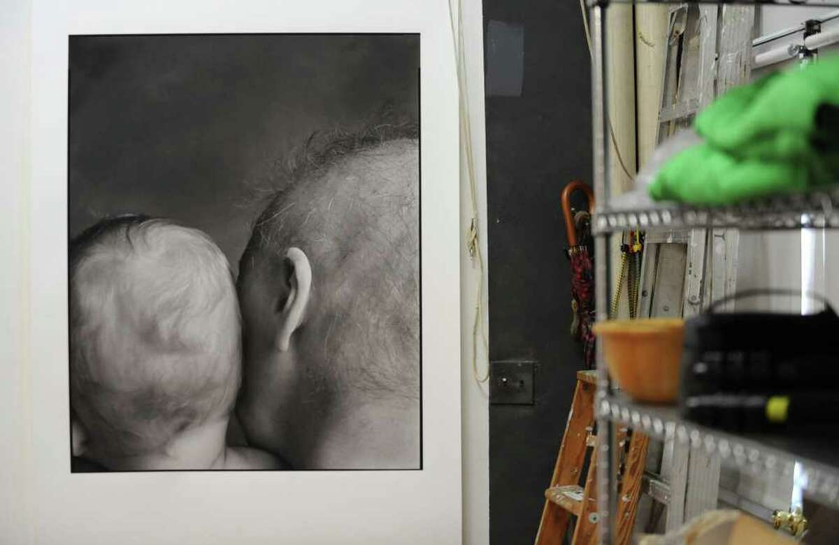 A photograph hangs on a backdrop in photographer Mark McCarty's home studio in Troy, N.Y. Monday Oct. 10, 2011. (Lori Van Buren / Times Union)