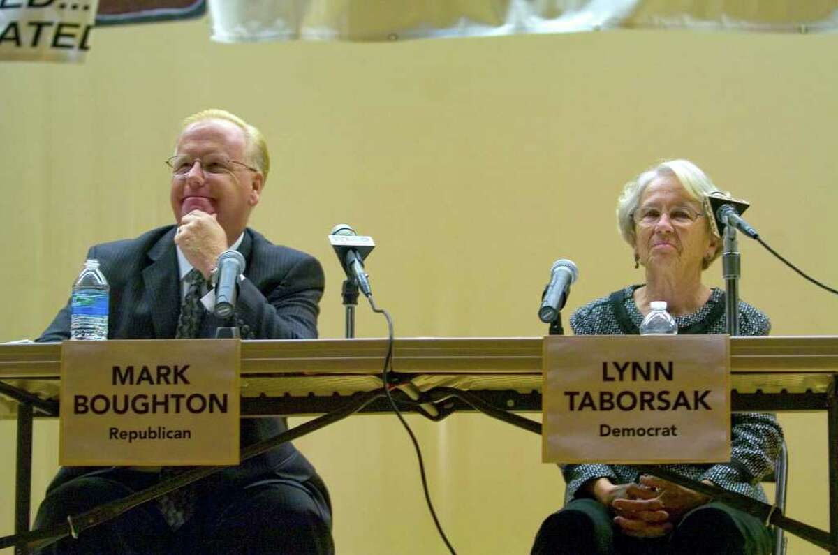Mayor Mark Boughton, left, and Lynn Taborsak wait for the debate to get started before the Danbury mayoral debate at Broadview Middle School on Tuesday, Oct. 18, 2011.
