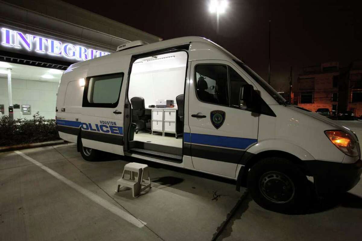 The Houston Police Department's "BAT" van sits in the parking lot of Integrity Bank off Washington Avenue. The mobile booking and processing unit is used to test those arrested for alcohol-related offenses.