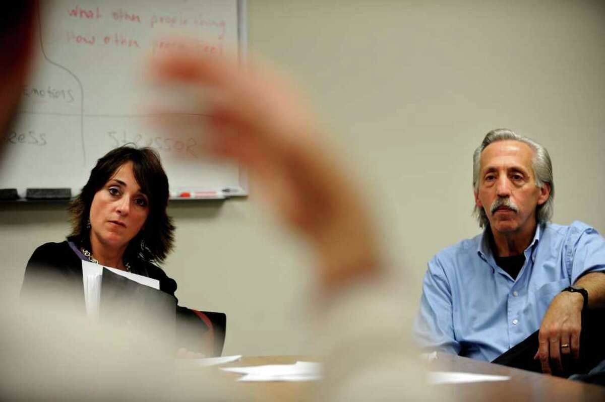 Facilitators, Lisa Benton and Stephen Lanza, lead a class for men convicted of domestic violence crimes who are learning to control their anger and deal with their emotions Thursday, Oct. 27, 2011 at the CT Probation office in Derby, Conn.