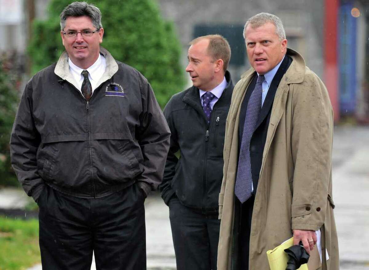 NY State Police investigators John Ogden, left, Albro Fancher and special prosecutor Trey Smith, at right, outside Rensselaer County Courthouse following meeting with a grand jury investigating ballot fraud in the 2009 Working Families Party primary in Troy Thursday Oct. 27, 2011. (John Carl D'Annibale / Times Union)