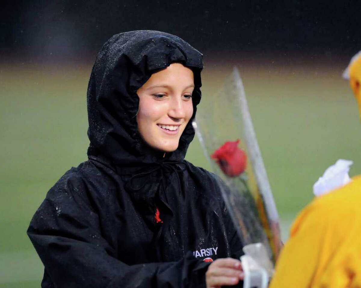 Greenwich senior soccer player Hayden Stein receives a flower at the start of girls high school soccer match between Greenwich High School and New Canaan High School at Greenwich, Thursday night, Oct. 27, 2011. The seniors on the Greenwich High School team were honored at the start of the game.