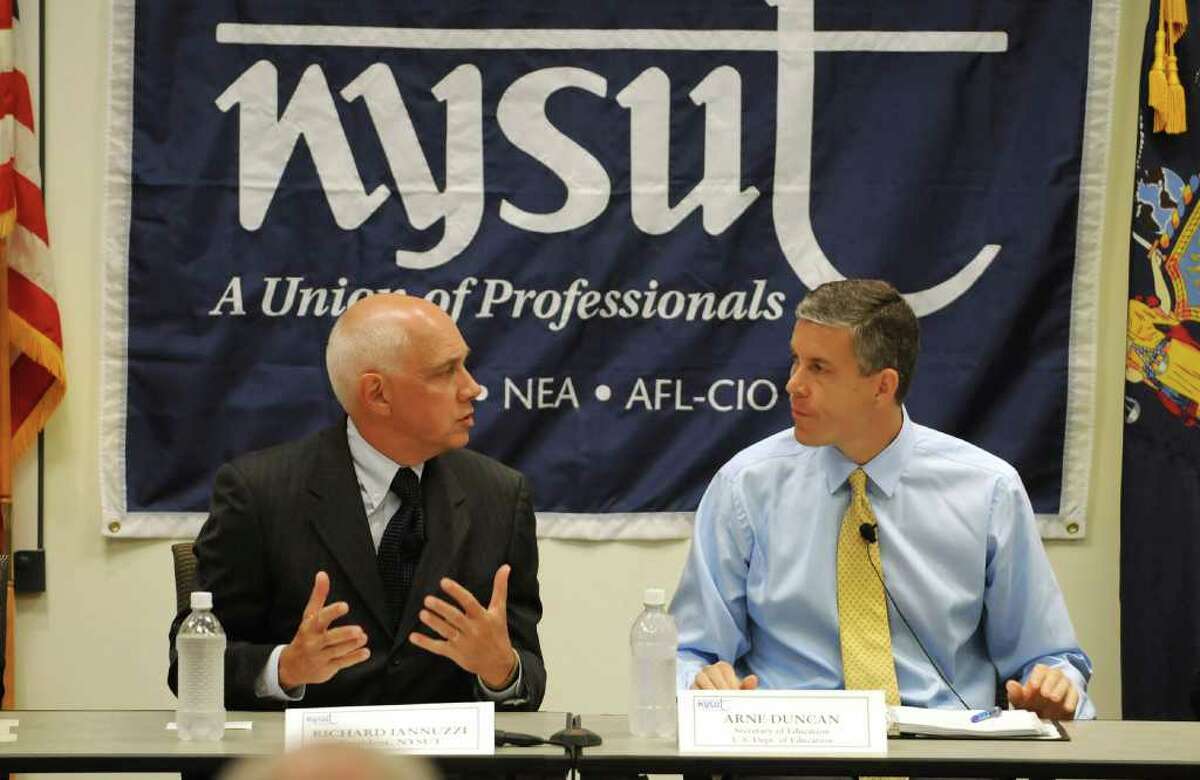 From left, Richard C. Iannuzzi, President, NYSUT, and Arne Duncan, U.S. Education Secretary, head a round table with teams of teachers about reform and pilot program on teacher evaluations, at NYSUT headquarters in Latham, NY on August 30, 2010. (Lori Van Buren / Times Union)