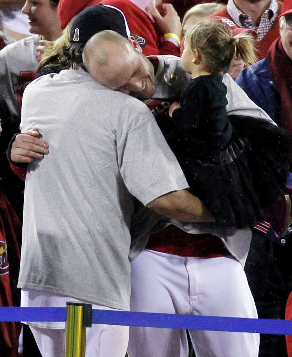 Photo: Cardinals Lance Berkman holds up the Commissioner's Trophy after  winning the 2011 World Series in St. Louis - STL20111028210 