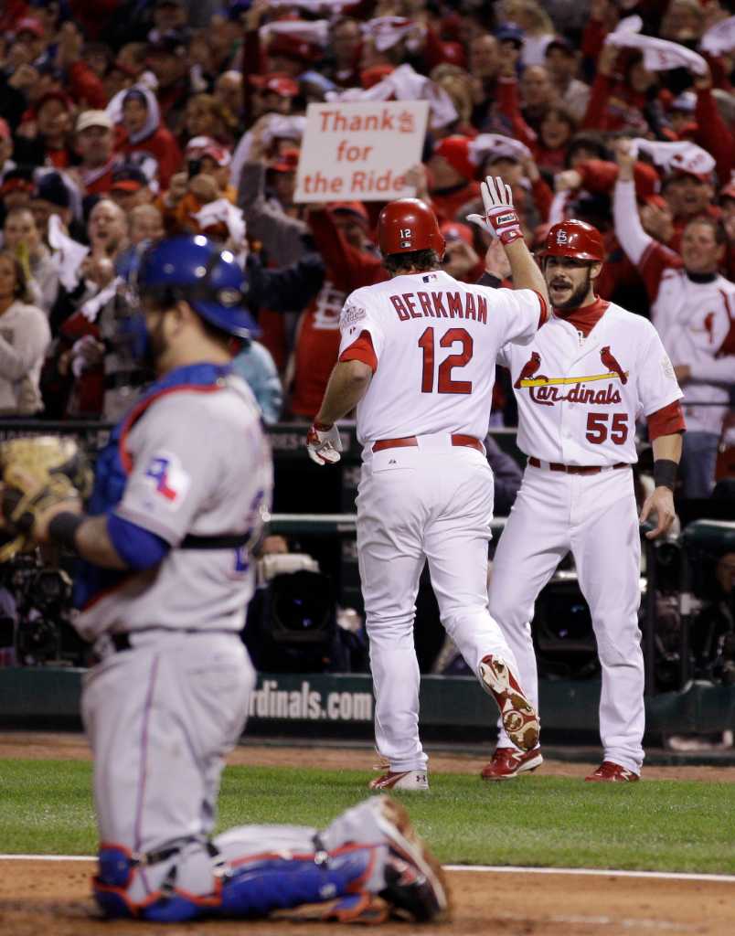 St. Louis Cardinals Lance Berkman embraces Albert Pujols after the