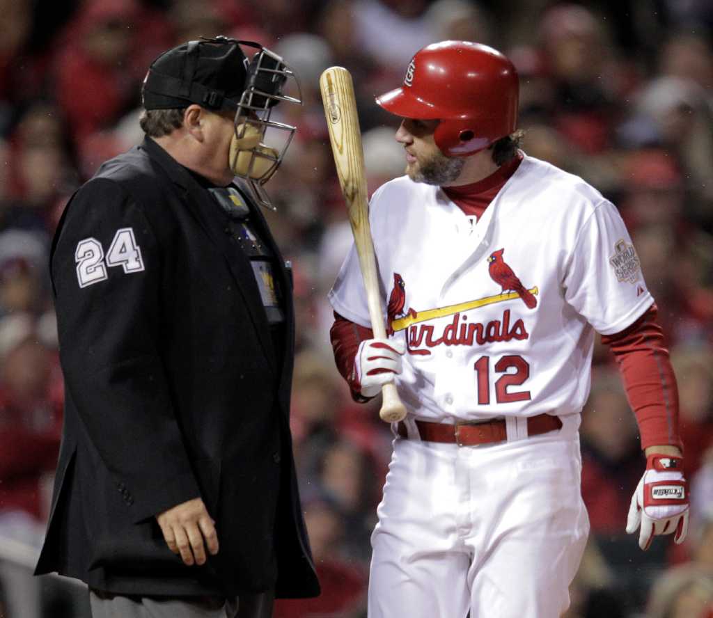 St. Louis Cardinals Lance Berkman embraces Albert Pujols after the  Cardinals won the 2011 World Series in St. Louis on October 28, 2011. The  Cardinals defeated the Texas Rangers 6-2 winning game