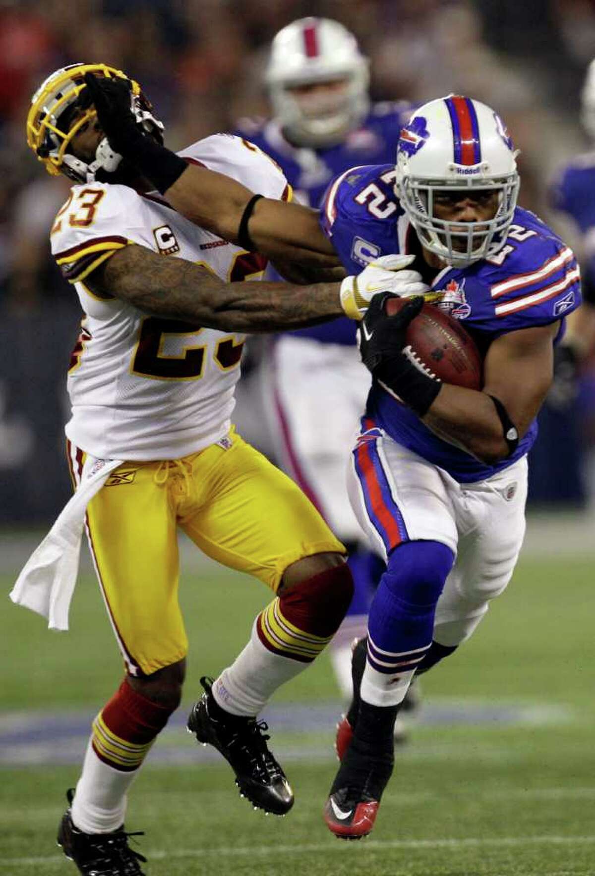 Buffalo Bills' Ryan Fitzpatrick runs against the Washington Redskins during  the second half of an NFL football game at the Rogers Centre in Toronto,  Sunday, Oct. 30, 2011. The Bills won 23-0.(AP