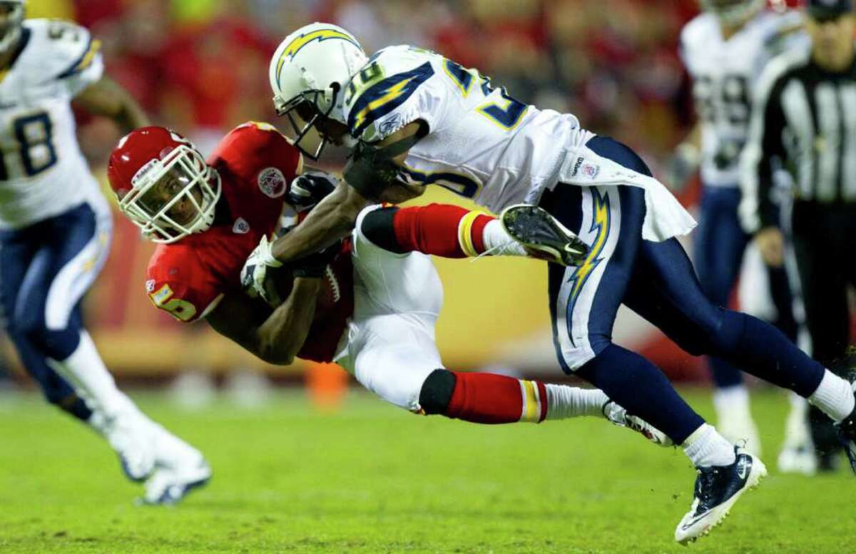 DAVID EULITT: McCLATCHY-TRIBUNE TOUGH YARDAGE: Chiefs wide receiver Steve Breaston, left, was hit and dropped by Chargers cornerback Marcus Gilchrist after a 29-yard gain Monday night.