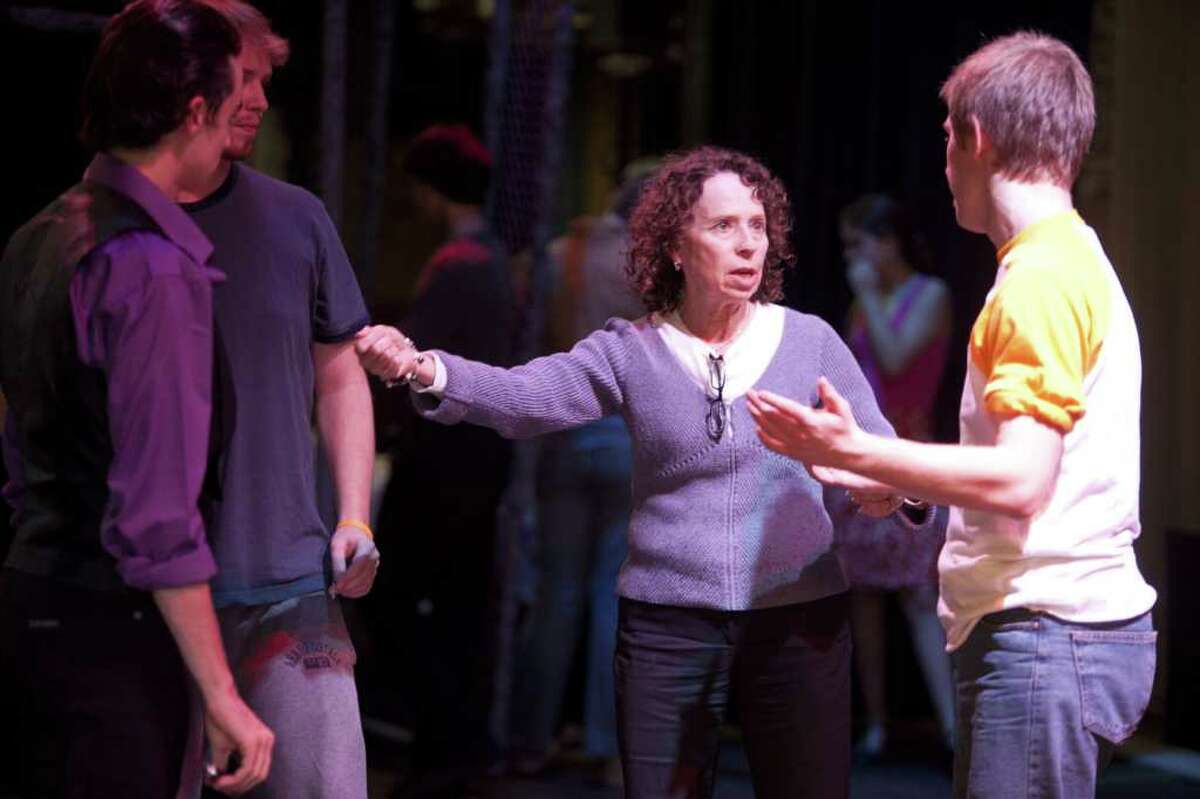 Joanne Kahn instructs a trio of dancers during a rehearsal for the Staples Players' production of "West Side Story." When the show closes later this month, Kahn plans to retire after 22 years as choreographer for the high school theater group. The show opens its six-performance run Friday evening, Nov. 11.