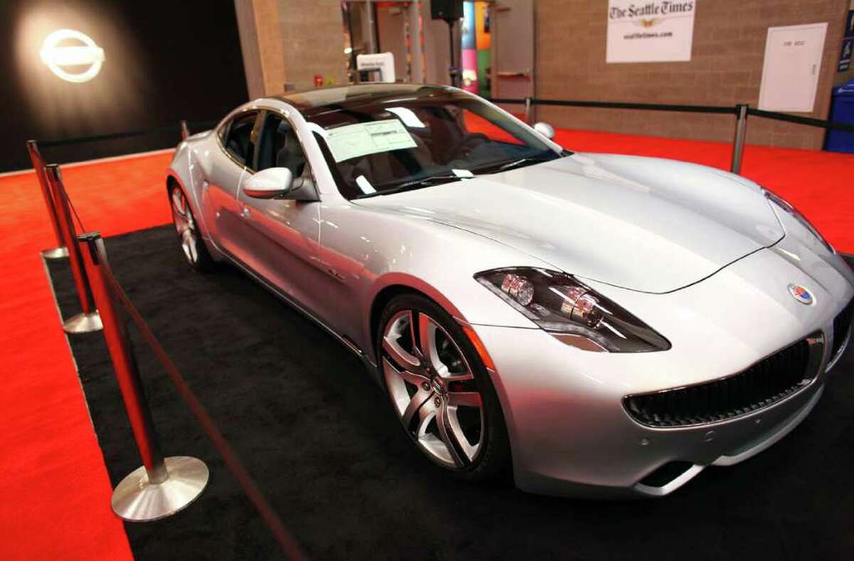 The Seattle Auto Show features the latest in electric cars, from compacts to super-cars like this 2012 Fisker Karma. The Karma, shown on Wednesday, November 2, 2011, features an all-electric stealth mode or fuel-assisted sport mode, has solar panels on the roof and costs $112,000. Before getting to other cars, here are a couple more angles on the Karma. The show runs through Sunday at CenturyLink Field Events Center.