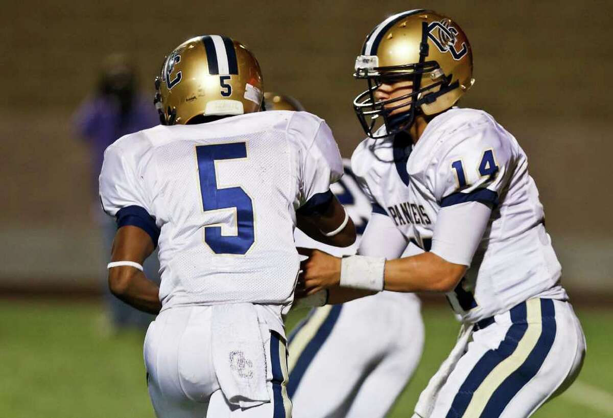 O'Connor quarterback Zach Galindo (right) hands the ball off to running back Tre Johnson during the fourth quarter of their District 27-5A game at Farris Stadium on Nov. 4, 2011. MARVIN PFEIFFER/mpfeiffer@express-news.net