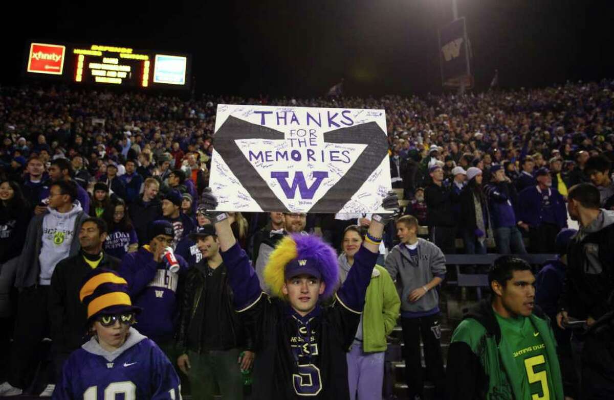 A fan holds up a sign thanking the stadium for the memories at Husky Stadium during a game against the Oregon Ducks on Saturday, November 5, 2011.