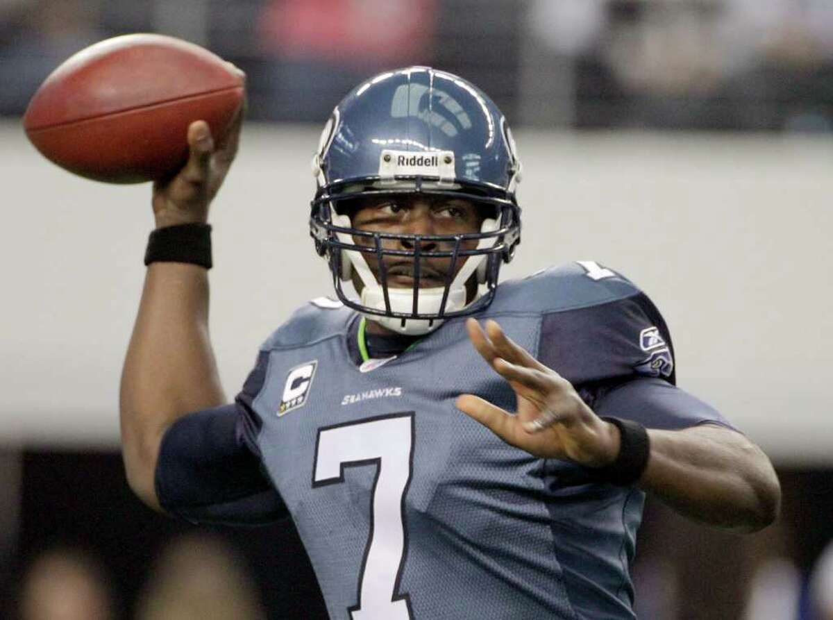 Seattle Seahawks quarterback Tarvaris Jackson looks to pass against the Dallas Cowboys during the first half of an NFL football game Sunday, Nov. 6, 2011, in Arlington, Texas.
