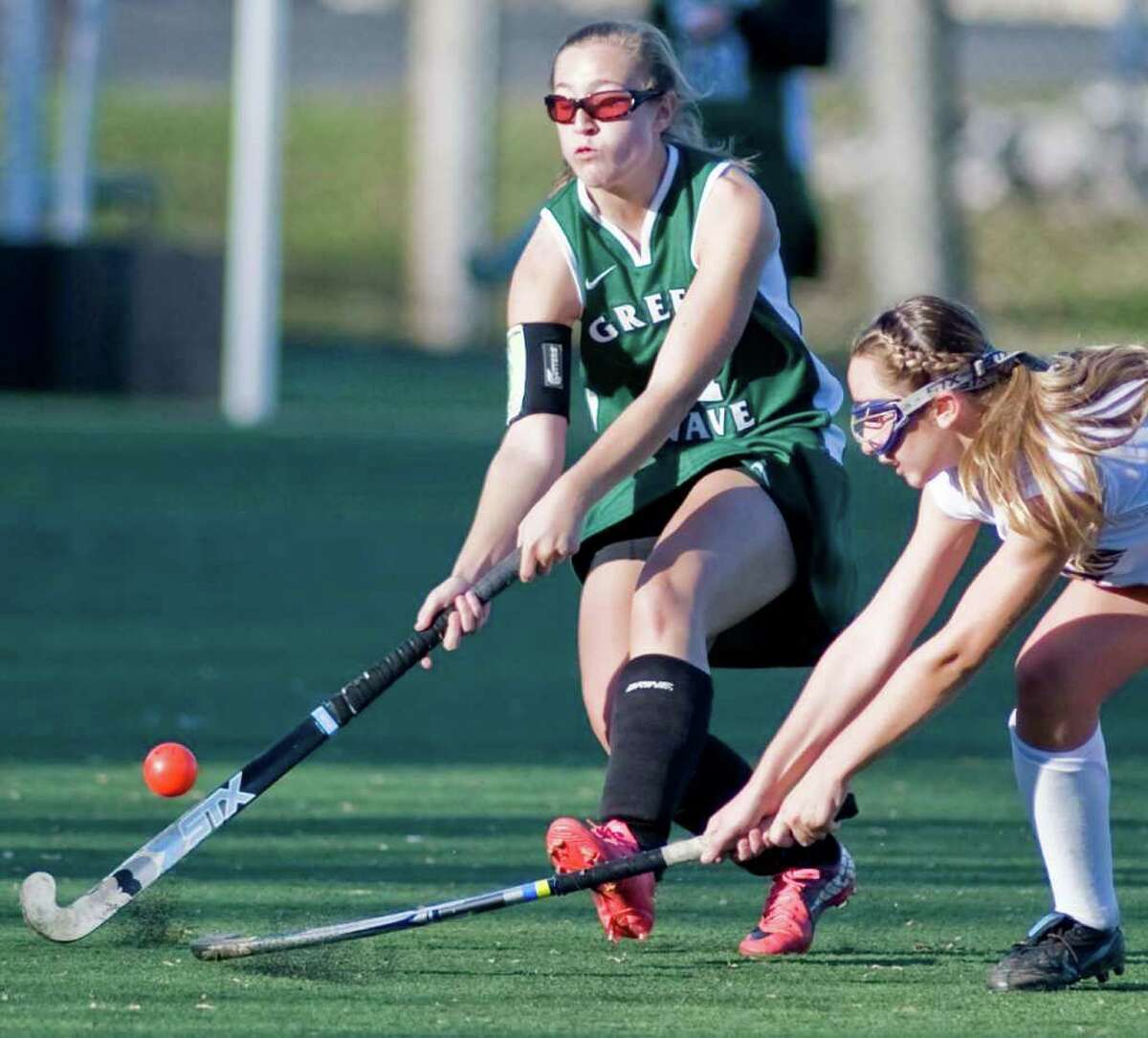 New Milford's Emily Sanders tries to control the ball against Lauralton Hall during the SWC field hockey semifinals at Weston High. Sunday, Oct. 6, 2011