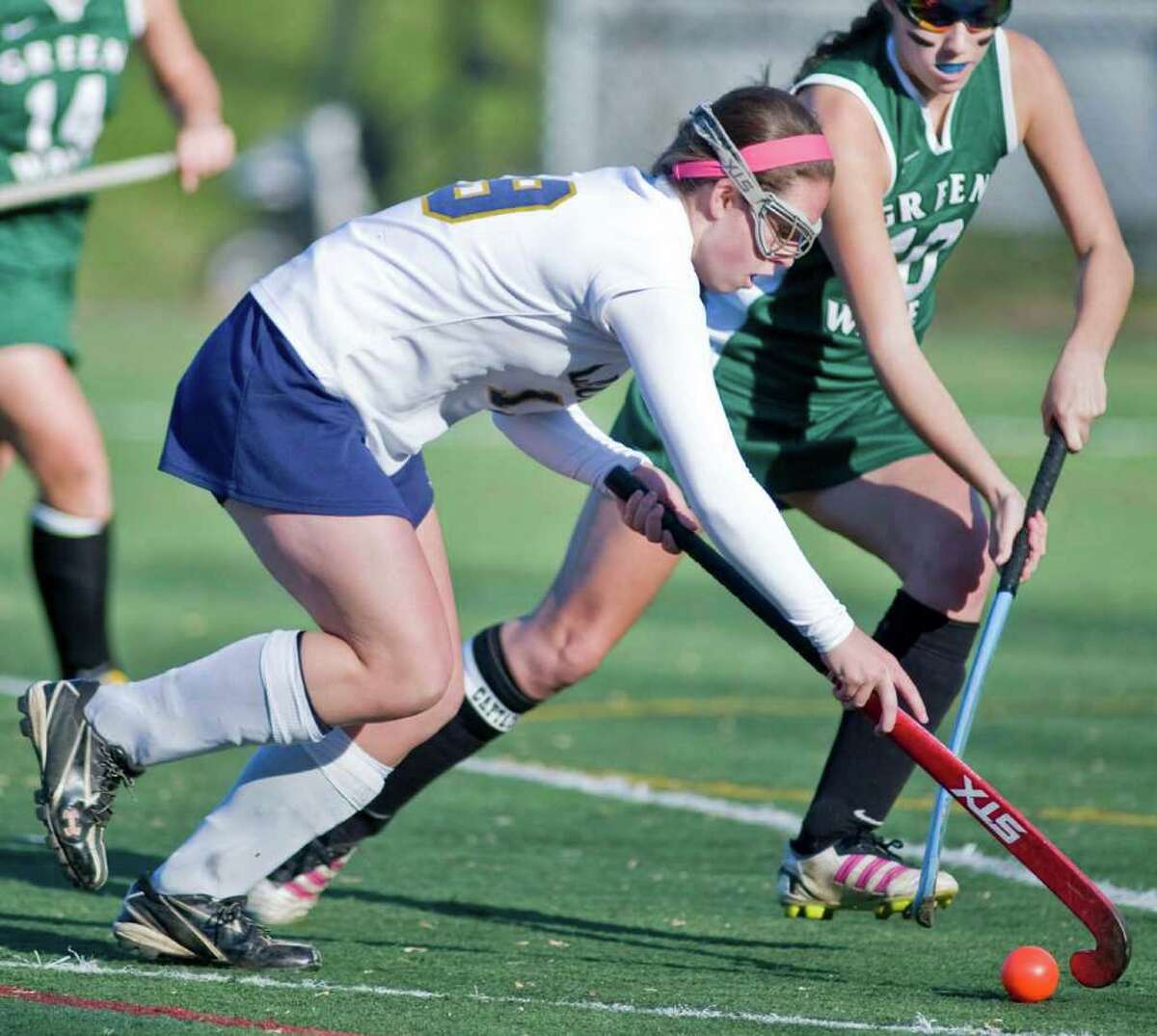 Lauralton Hall's Maureen Connolly moves the ball against New Milford during the SWC field hockey semifinals at Weston High. Sunday, Oct. 6, 2011