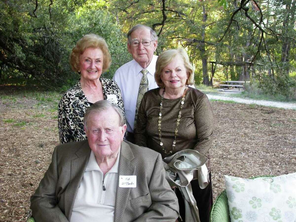 Red McCombs (seated) enjoys a moment outdoors at the dedication of the Red and Charline McCombs Tree House at the Cibolo Nature Center on Wednesday with (from left) his wife, Charline, and tree house designer Al Groves and his wife, Janie.