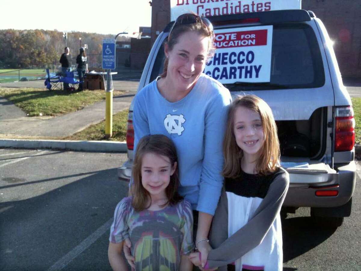 At Brookfield High School, resident Katie Mahoney brought daughters Abigail, 5 and Bailey, 7, to vote Tuesday.