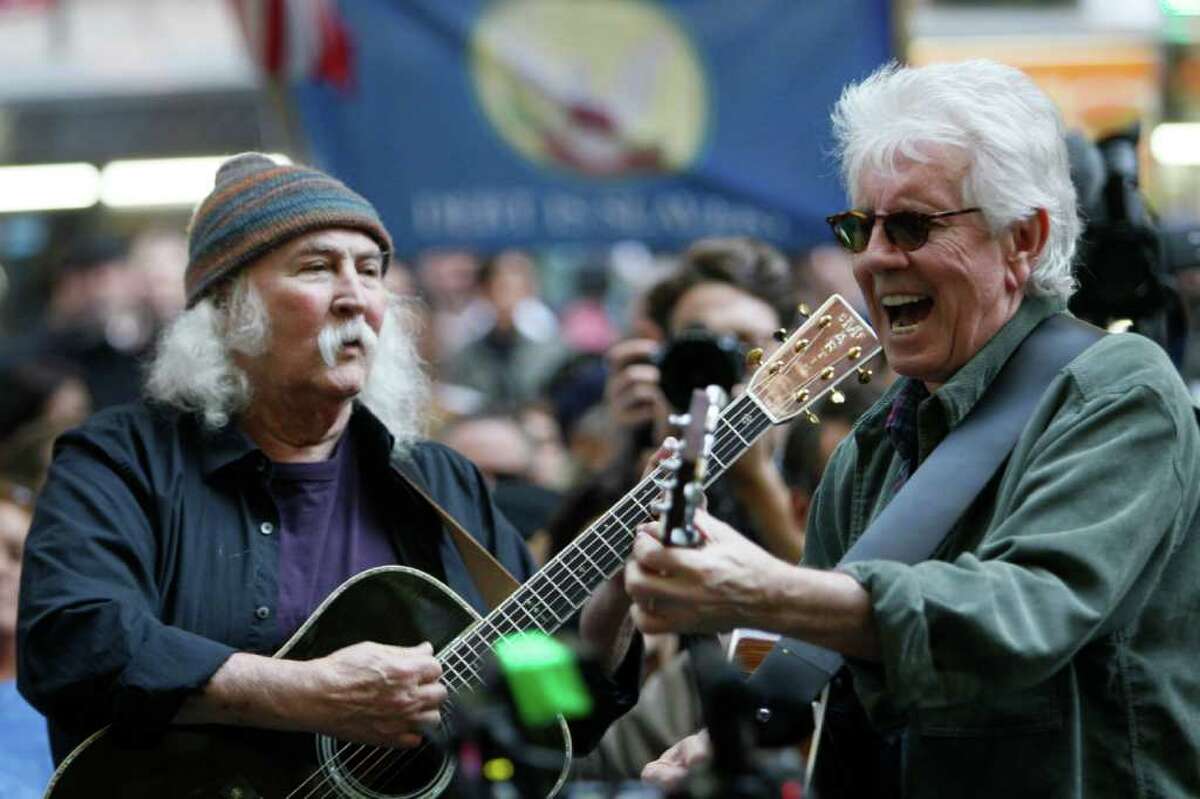 David Crosby, left, and Graham Nash perform at the Occupy Wall Street encampment at Zuccotti Park, Tuesday, Nov. 8, 2011 in New York. (AP Photo/Mary Altaffer)