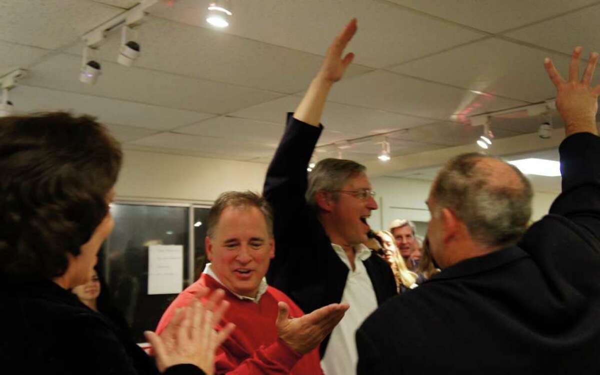 The four Republican candidates for the Planning and Zoning Commission celebrate their election wins at the Republican Town Committee's election headquarters on Tuesday, Nov. 8, 2011. From left are: Catherine Walsh, Jack Whittle, Al Gratrix and Chip Stephens.