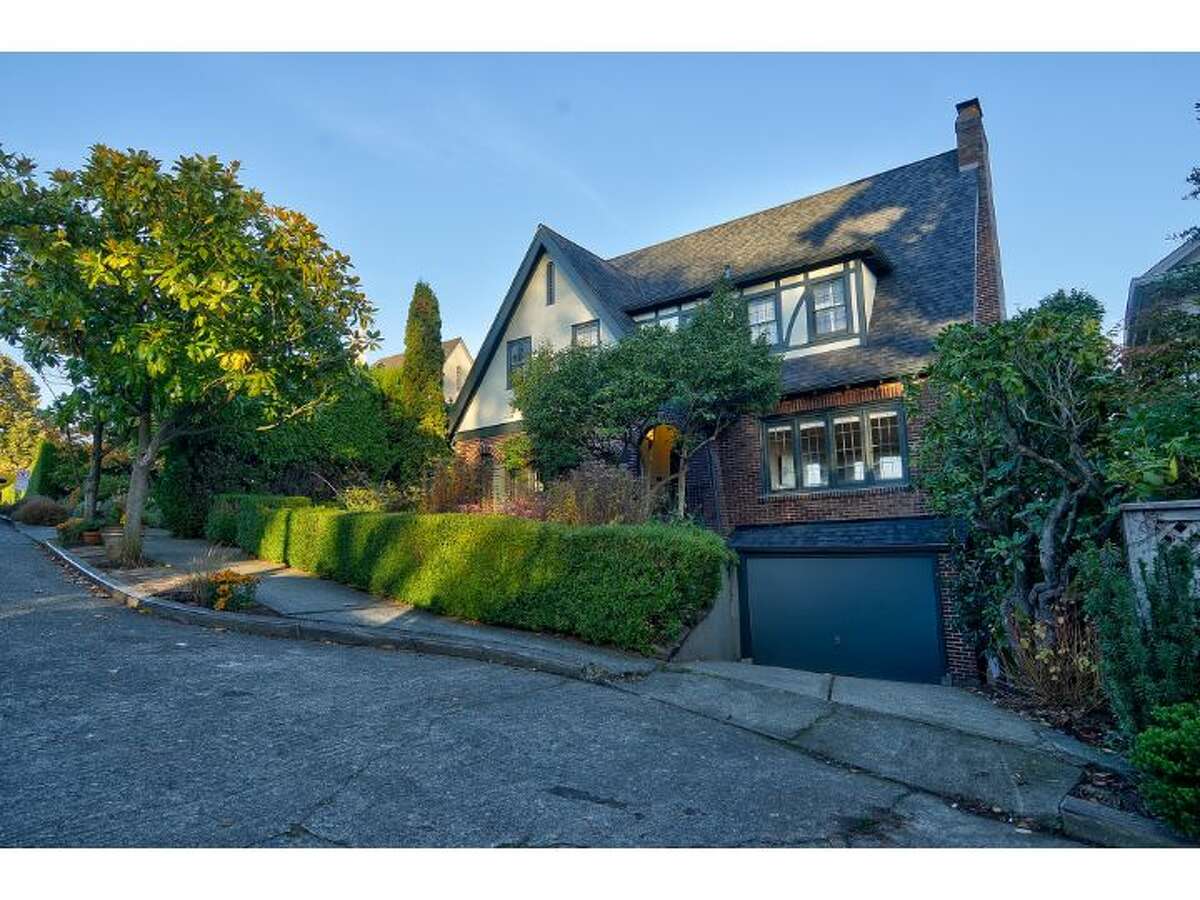 Here's an elegant brick Tudor in Seattle's classic Denny Blaine neighborhood, at 1516 40th Ave. The 3,460-square-foot house, built in 1925, has four bedrooms, three bathrooms, coved ceilings, arched doorways, leaded glass, built-in cabinets a finished basement with a rec room and bar, two fireplaces and three decks, with views of Lake Washington and Mount Rainier. It sits on a 6,000-square-foot lot and is listed for $1.595 million.