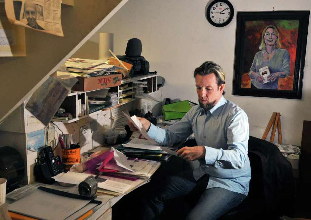 Raymond Felix, new director of the Fulton Street Gallery in Troy, at his desk Friday Nov. 4, 2011. (John Carl D'Annibale / Times Union)