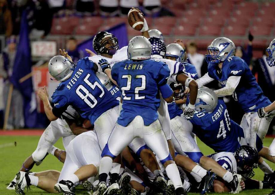 austin (12) of the angleton wildcats rushes for a 1 yard touch