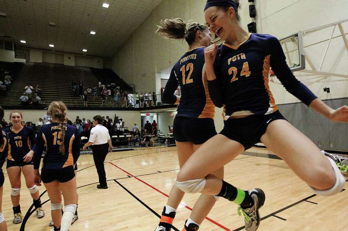 Poth's Micah Weaver (24) leaps jubilantly with teammate Jordan Kotara (12) after their team defeated Marion in the Region IV-2A volleyball championship game at Littleton Gym on Saturday, Nov. 12, 2011. Poth defeated Marion in three straight to move onto the state tournament.