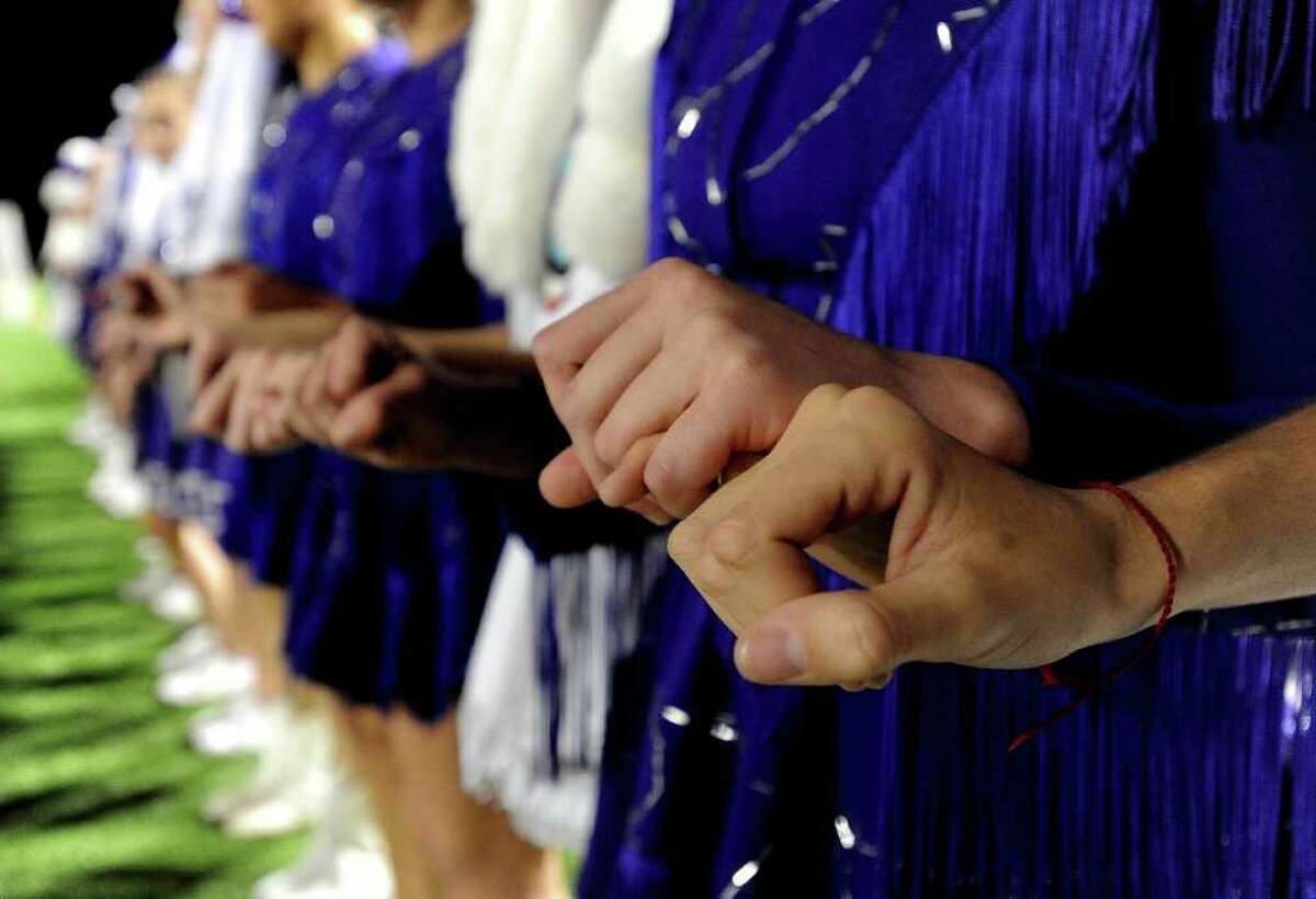 The PNG Indianettes hold hands during the kick-off against Dayton at the Beaumont ISD Carrol A. "Butch" Thomas Educational Support Center in Beaumont, Saturday, November 12, 2011. Tammy McKinley/The Enterprise