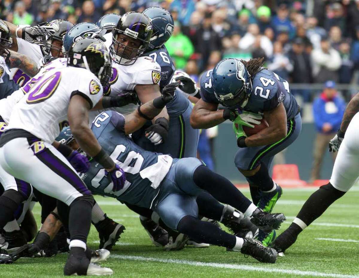 SEATTLE, WA - NOVEMBER 13: Running back Marshawn Lynch #24 of the Seattle Seahawks scores a touchdown against the Baltimore Ravens at CenturyLink Field on November 13, 2011 in Seattle, Washington.