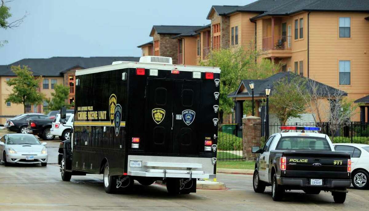 A San Antonio Police Department Crime Scene Unit enters the Hacienda del Sol Luxury Apartment Homes at 6710 Babcock Tuesday November 15, 2011 where a man opened fire with an AK-47 rifle killing another man. A 20-year-old man is in custody for the shooting. JOHN DAVENPORT/jdavenport@express-news.net