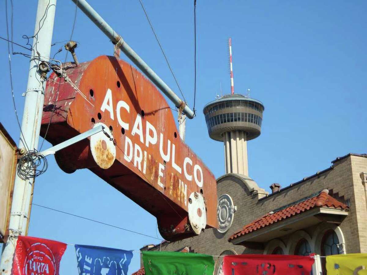A photo of the famous old car sign that used to hang in front of the Acapulco Drive Inn.