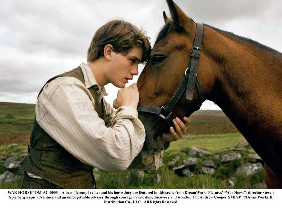 "WAR HORSE" DM-AC-00034 Albert (Jeremy Irvine) and his horse Joey are featured in this scene from DreamWorks Pictures' "War Horse", director Steven Spielberg's epic adventure and an unforgettable odyssey through courage, friendship, discovery and wonder. Ph: Andrew Cooper, SMPSP DreamWorks II Distribution Co., LLC. All Rights Reserved.