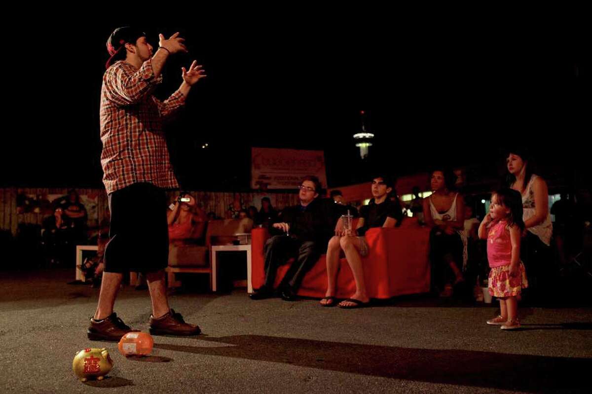 Christopher "Rooster" Martinez performs during a poetry slam at Bubblehead Tea in San Antonio on Friday, August 5, 2011.