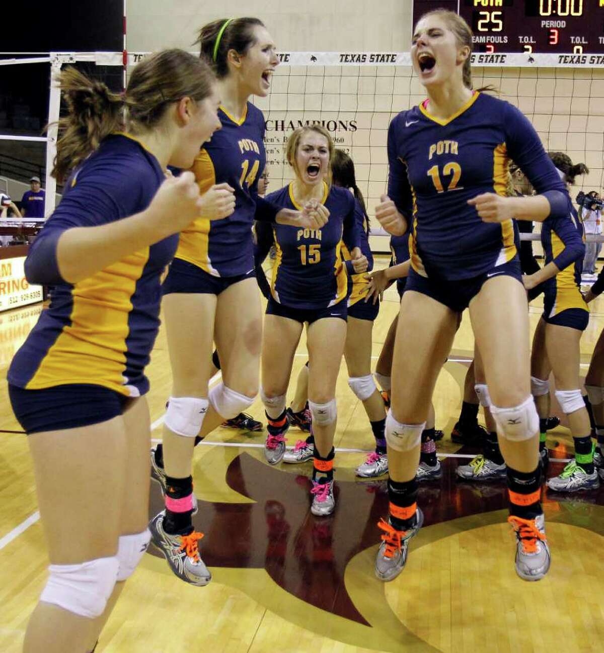 Poth's Jordan Kotara, right, celebrates with her teammates, including Kelsee Felux (14) and Corin Nelson (15), after defeating Nocona in the class 2A state volleyball final at Strahan Coliseum at Texas State University on Saturday, Nov. 19, 2011. MICHAEL MILLER / mmiller@express-news.net