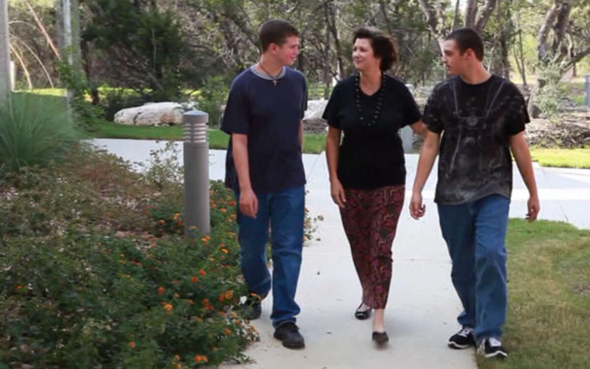 IN THIS SCENE FROM "COPING TO EXCELLING,' JENNIFER ALLEN IS SEEN WITH HER SONS SAM (LEFT) AND CHARLIE. SAM HAS BEEN DIAGNOSED WITH A FORM OF HIGH-FUNCTIONING AUTISM CALLLED ASPERGER'S SYNDROME.