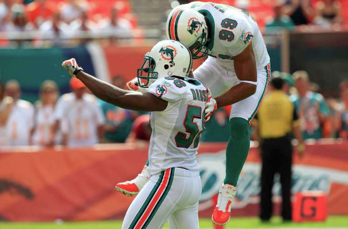 Miami Dolphins linebacker Jason Taylor (99) leaves the field for