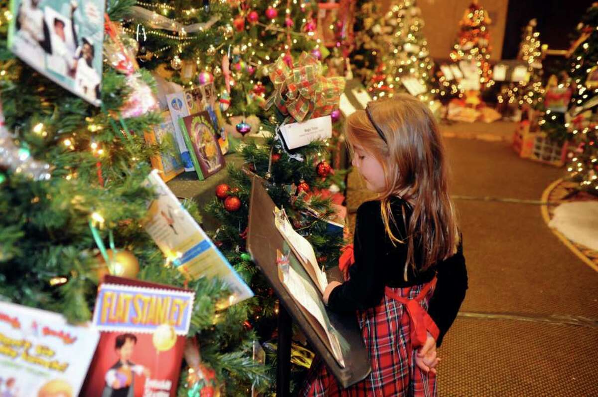 Bella Andrade, 6, of New Canaan, looks at the trees at the Junior League of Greenwich's 35th annual holiday fundraiser, "The Enchanted Forest," at the Hyatt Regency Greenwich in Old Greenwich Sunday, Nov. 20, 2011.