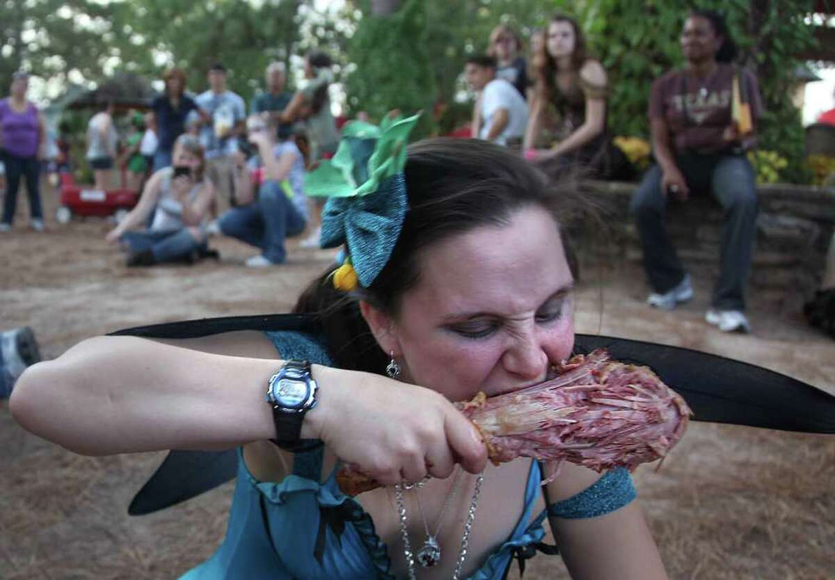 Heather Mann, 25, of Magnolia, chows down on a turkey leg during the "Turkey Leg Eating Contest" at the Renaissance Festival on Sunday, Nov. 20, 2011, in Plantersville. Dergan won the competition.