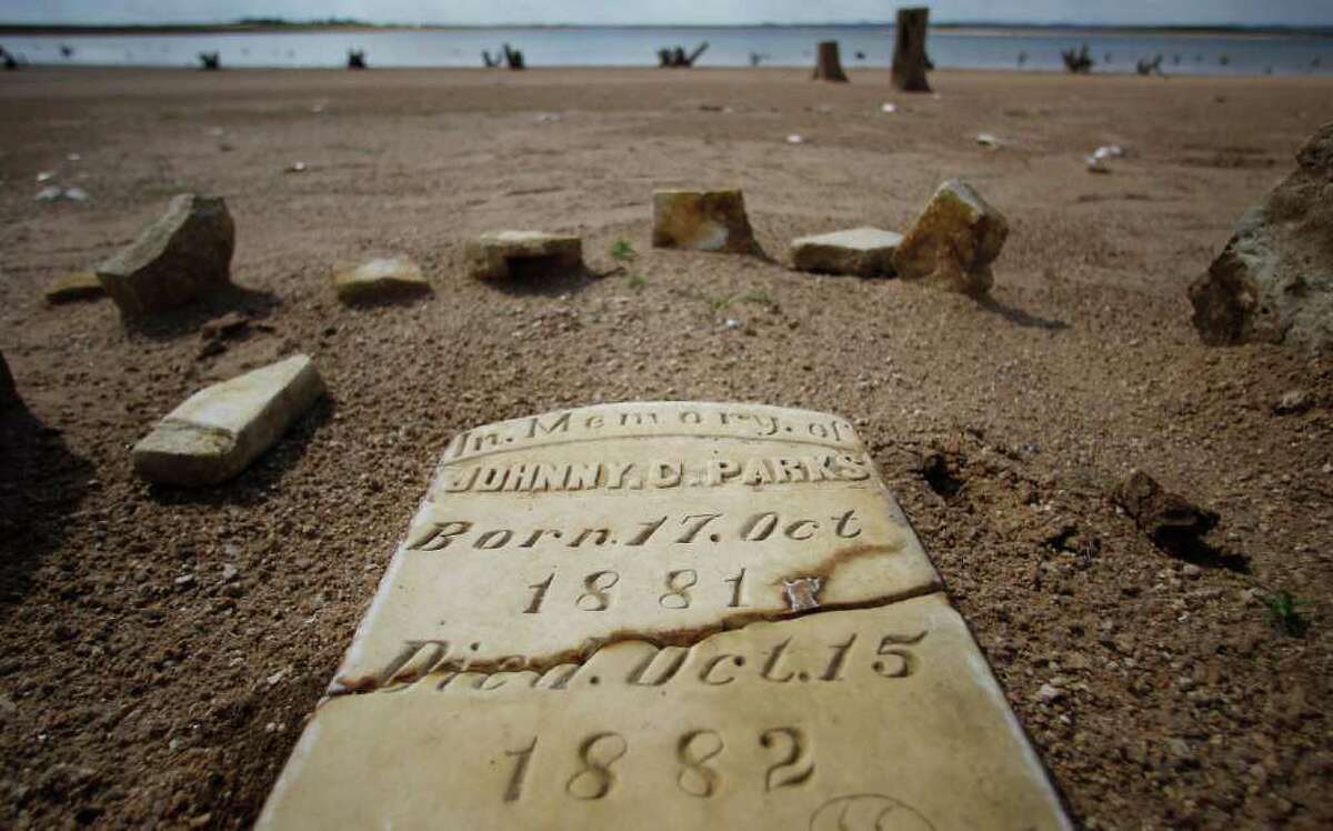 Normally at least 20 to 30 feet underwater, this child's grave is among the few that resurfaced during Texas' last drought on the dry, sandy Lake Buchanan near Bluffton. 