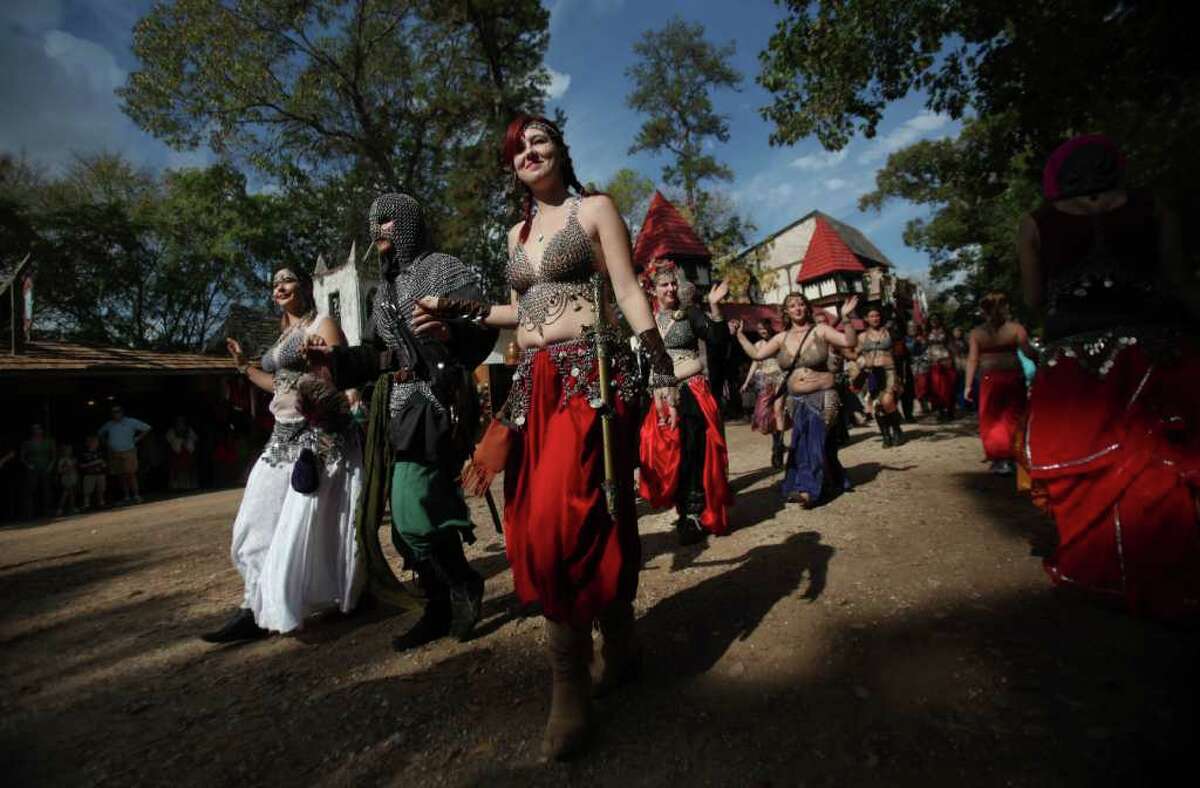 Parade participants wave to the crowd during the Renaissance Festival on Sunday, Nov. 20, 2011, in Plantersville. ( Mayra Beltran / Houston Chronicle )