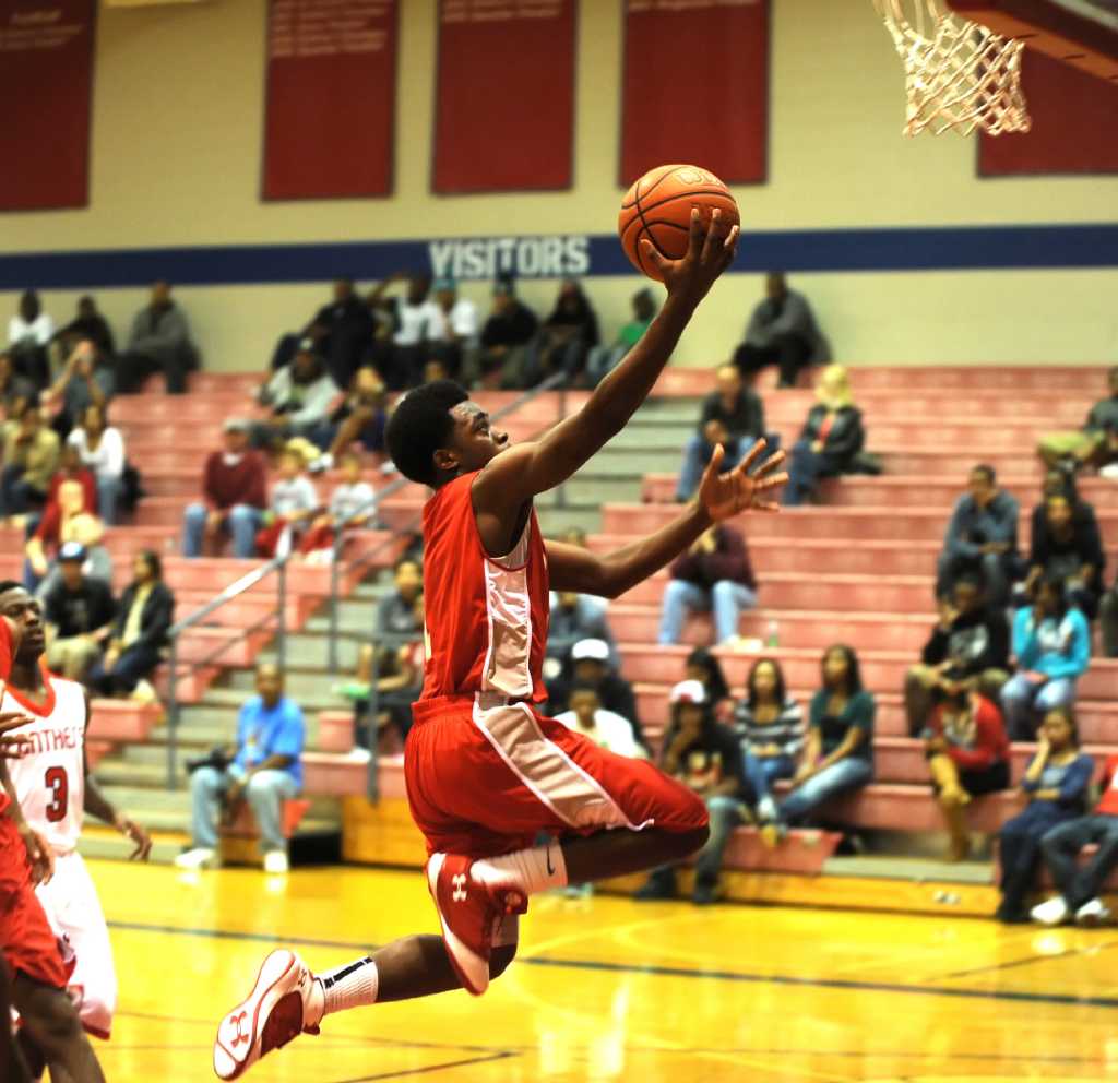 Boys basketball Travis starts season strong