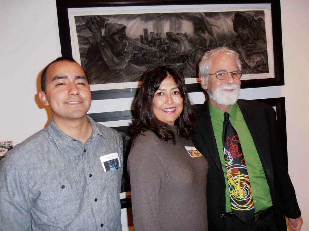Artist Vincent Valdez, from left, with Sanda Guerra and curator David Rubin at the San Antonio Museum of Art’s contemporary preview of recent acquisitions.