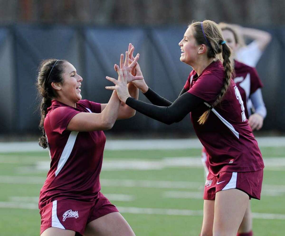 St. Luke's School players Salma Anastasio, left, and Caroline Parsons, celebrate a goal by Parsons during the FAA girls soccer championship between St. Luke's School and Greenwich Academy at St. Luke's, New Canaan, Nov.11, 2011.