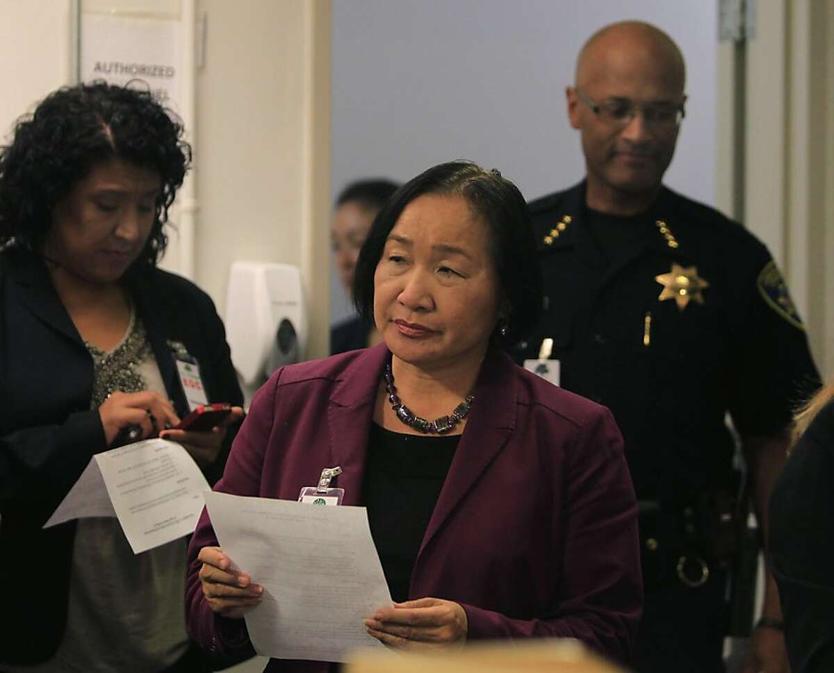 Oakland mayor Jean Quan prepares to update the media on the general strike called by Occupy Oakland with interim police chief Howard Jordan (right) in Oakland, Calif. on Wednesday, Nov. 2, 2011. At left is city administrator Deanna Santana.