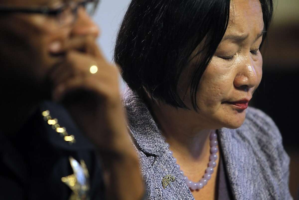 Oakland Mayor Jean Quan listens as Deanna Santana, off camera, answers a question during a press conference at City Hall in Oakland, Calif, on Wednesday, October 26, 2011. Quan, interim Police Chief Howard Jordan, and City Administrator Deanna Santana anwered questions, Wednesday, after police used tear gas and non-lethal weapons against demonstrators from the Occupy Oakland group the previous night.