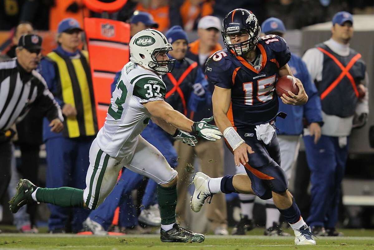 Quarterback Tim Tebow of the Denver Broncos runs against the