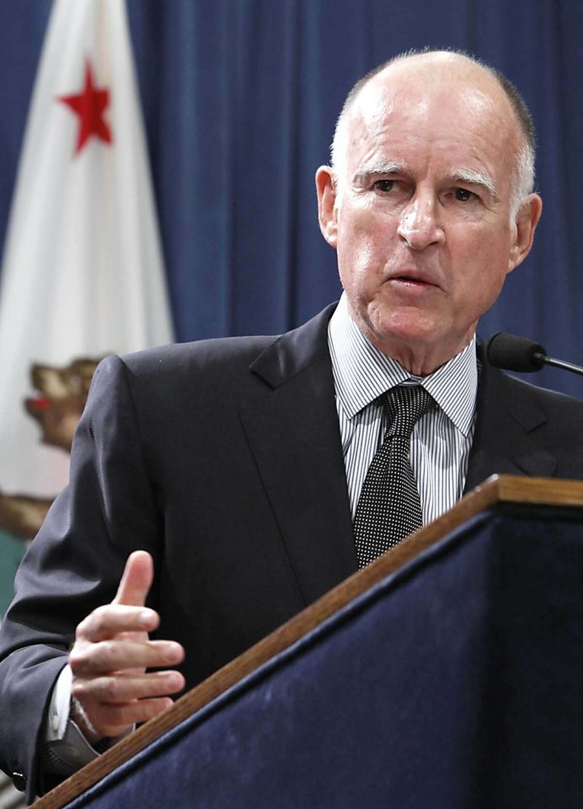 Gov. Jerry Brown discusses his proposal to rollback public employee pension benefits during a news conference at the Capitol in Sacramento, Calif., Thursday, Oct. 27, 2011. Brown's plan, which would require approval from the Legislature, would raise the retirement age to 67 for new employees, who are not public safety workers and require state and local employees to pay more toward their retirement and health care. The governor also proposes a mandatory 'hybrid" system in which future retirees would get their retirement from a guaranteed benefit and a 401(k)-style plan.(AP Photo/Rich Pedroncelli) Ran on: 11-14-2011 Gov. Jerry Brown plans to put a tax increase on the ballot.