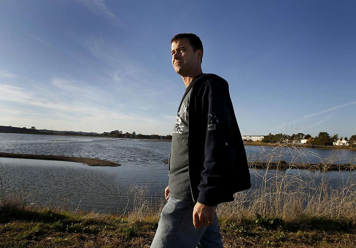 Biologist Julian Wood, who co-authored the report, walks near a diked marsh in Petaluma, Calif. A new Point Reyes Bird Observatory study is predicting the possibility of a 93 percent loss of San Francisco Bay tidal marshes in the next 100 years under the worst case scenarios of high sea level rise and low sediment availability. Ran on: 11-17-2011 Biologist Julian Wood, co-author of study on warmings effects, visits a Petaluma diked marsh. Ran on: 11-17-2011 Biologist Julian Wood, co-author of study on warmings effects, visits a Petaluma diked marsh.